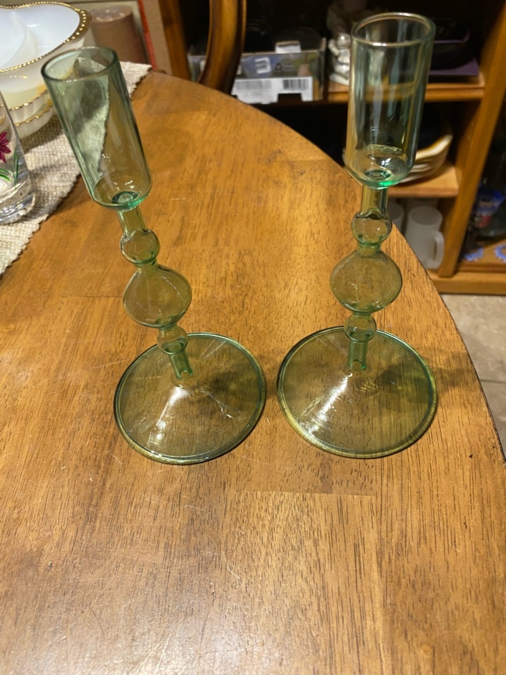Poketo green glass candlesticks set of 2. Like new. Fits tapered candles 7 3/4”